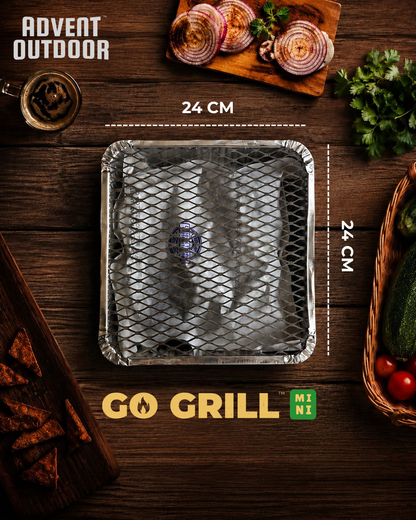 Go Grill Mini on a wooden surface with vegetables and cooking items